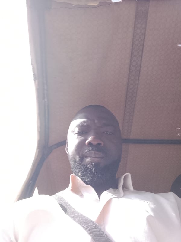 Man takes selfie in auto-rickshaw in Jos, Nigeria