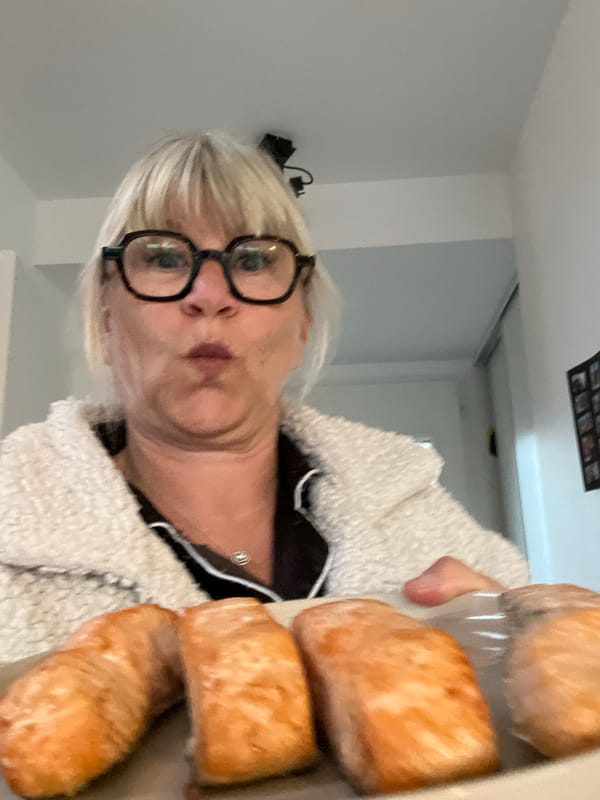 Woman with bread rolls, pets captured in Chambœuf afternoon