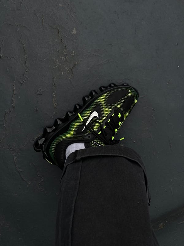 Person in neon sneakers spotted on wet London pavement