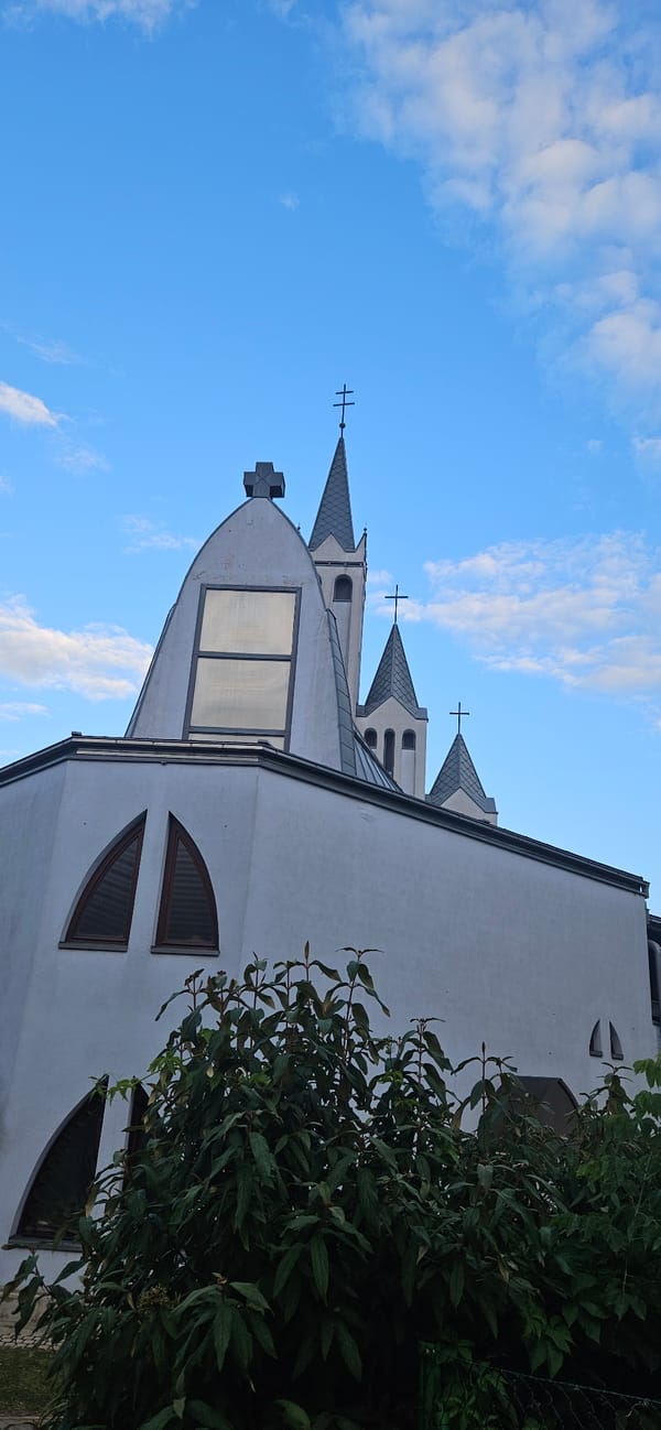 Churches, pine trees, and street details in Hévíz, Hungary