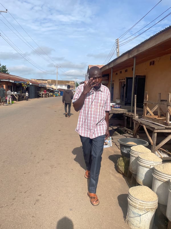 Everyday street scenes near a Jos market, Nigeria.