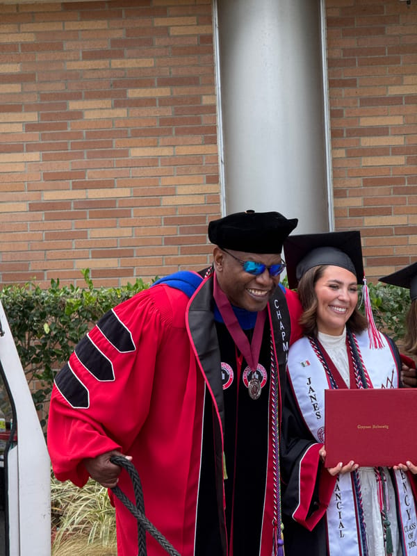 Dog dons graduation cap and gown at Chapman University