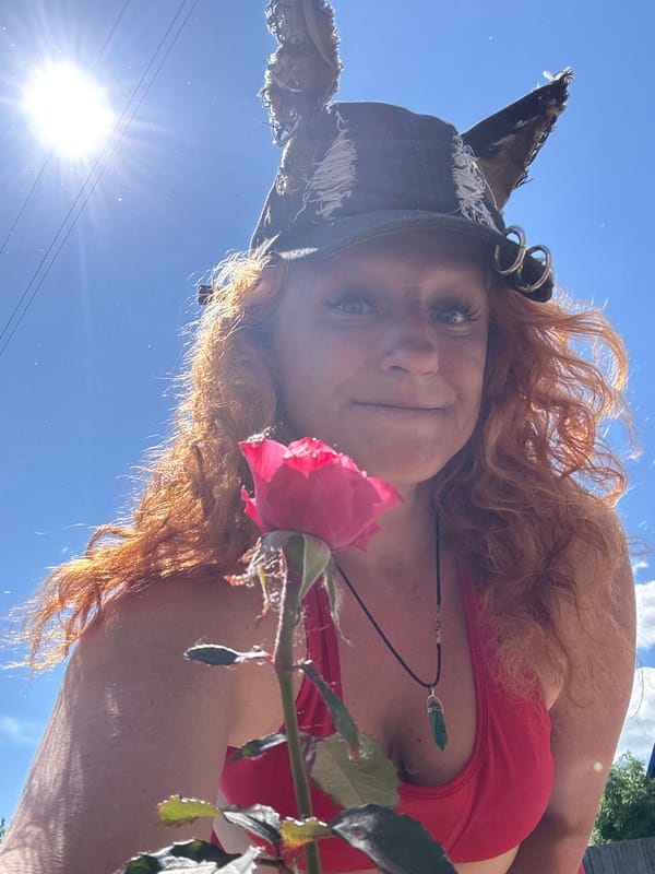 Red-haired woman in cat-ear hat photographed in Chaikovsky