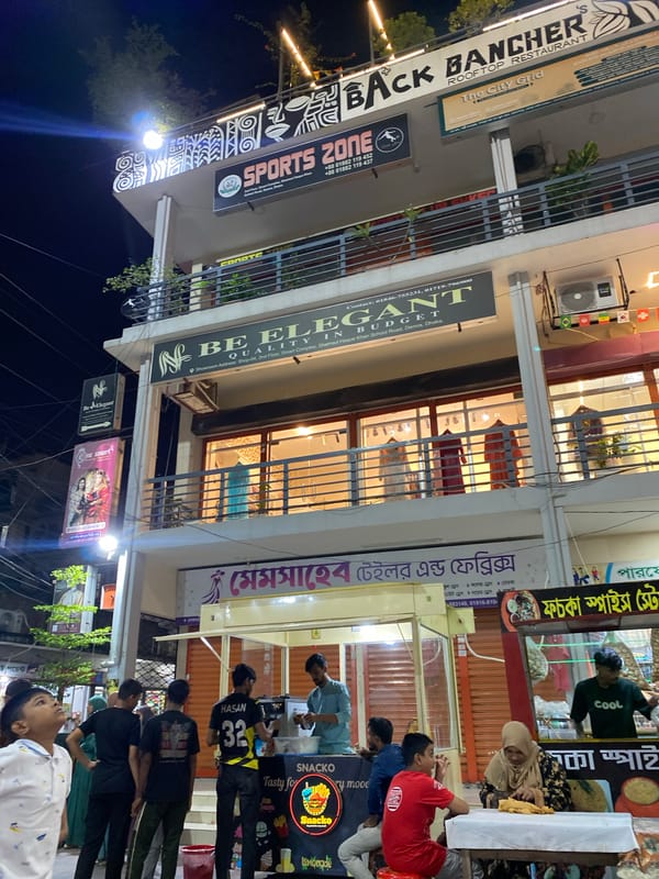 Evening out along Dhaka's lit-up commercial streets and food stalls