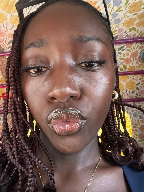 Woman with braided hair photographed in Kuchingoro, Nigeria