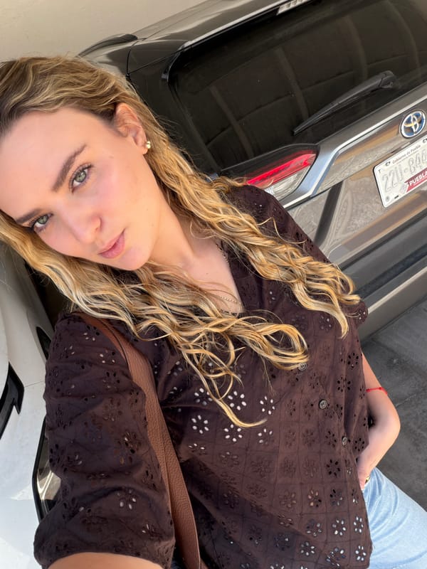 Woman photographed on cobblestone street in Tlaxcalancingo, Mexico