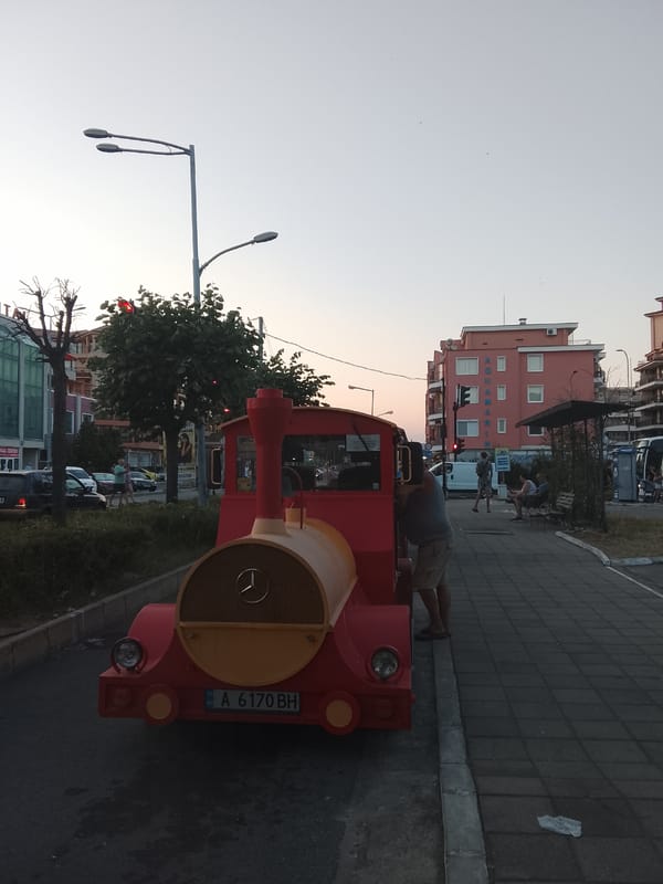 Tourist train and seaside hotels along Nesebar's coastal strip