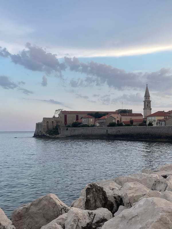 Evening stroll through Mediterranean coastal town captures harbor life