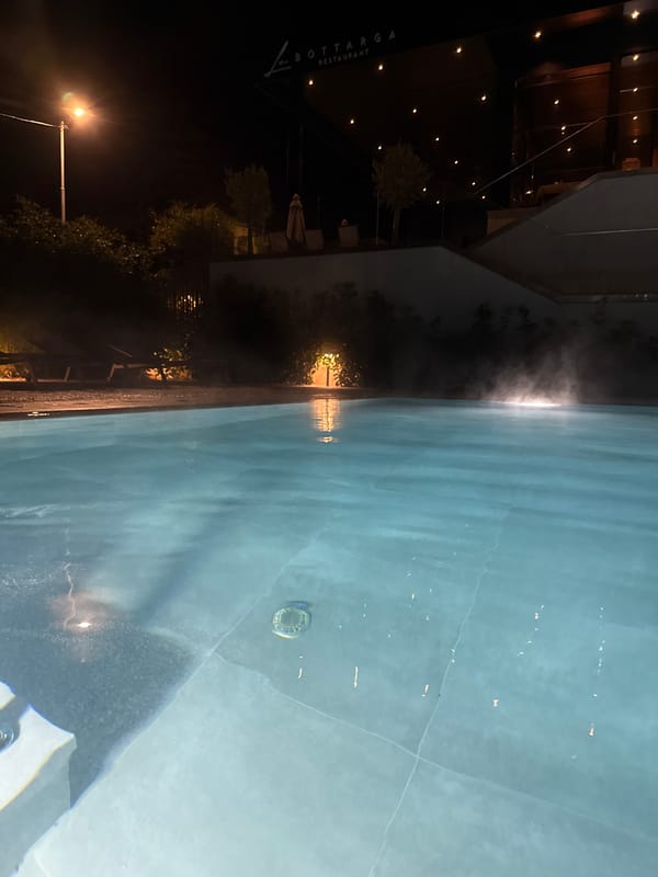 Steam rises from calm pool near Burgas restaurant