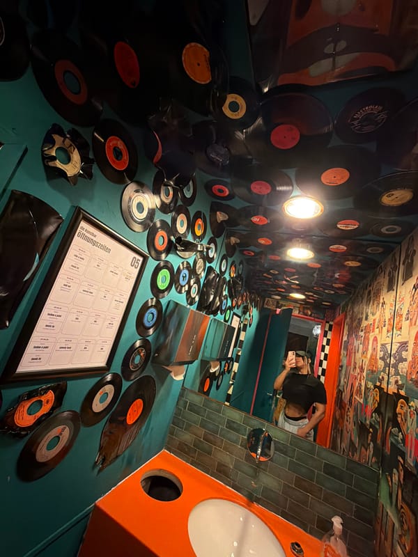 Patron captures vinyl-decorated bar interior in Cologne