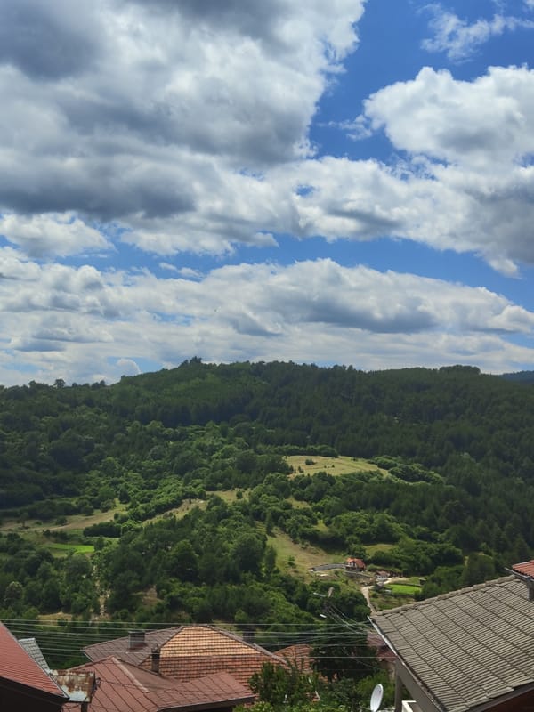 Forested hills and rural settlement in Pletena, Bulgaria