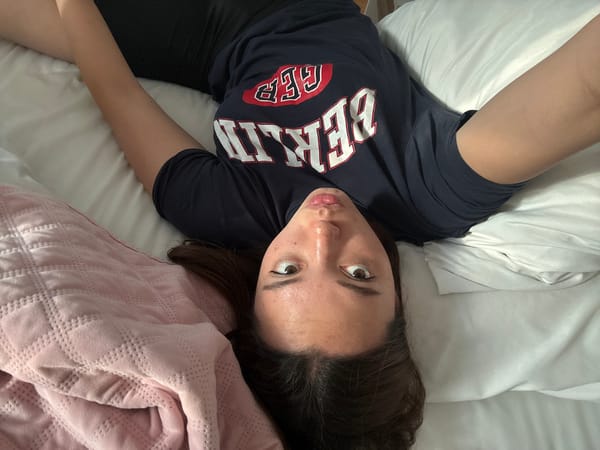 Person in Berlin shirt observed lying on bed in Mexico