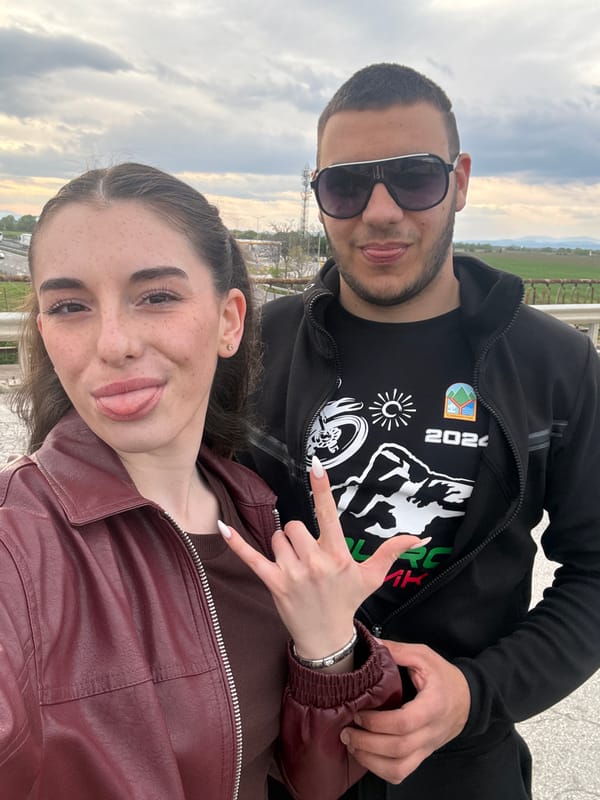 Cyclists pose for photos near highway bridge in Radinovo