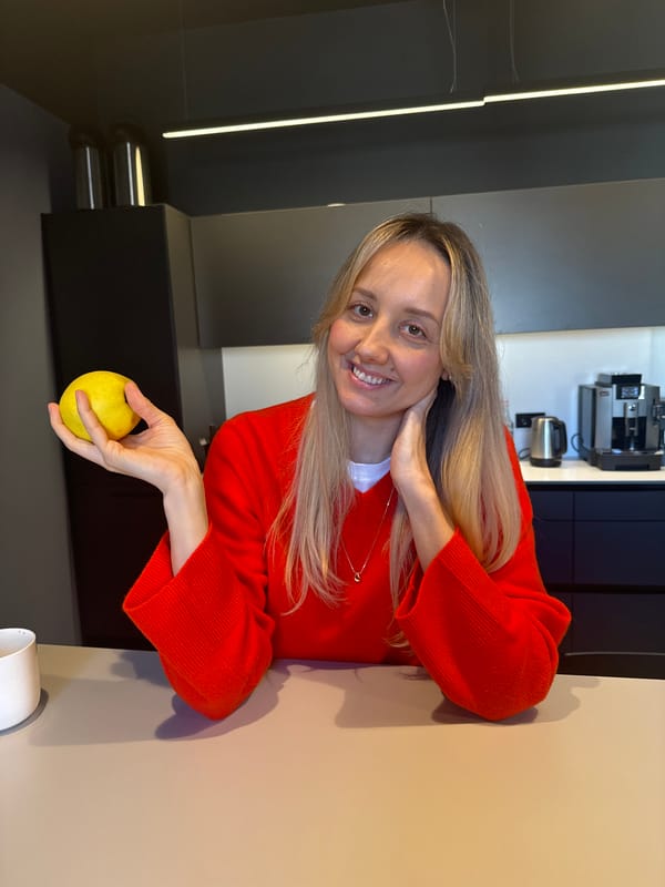 Woman with yellow apple spotted in Riga kitchen
