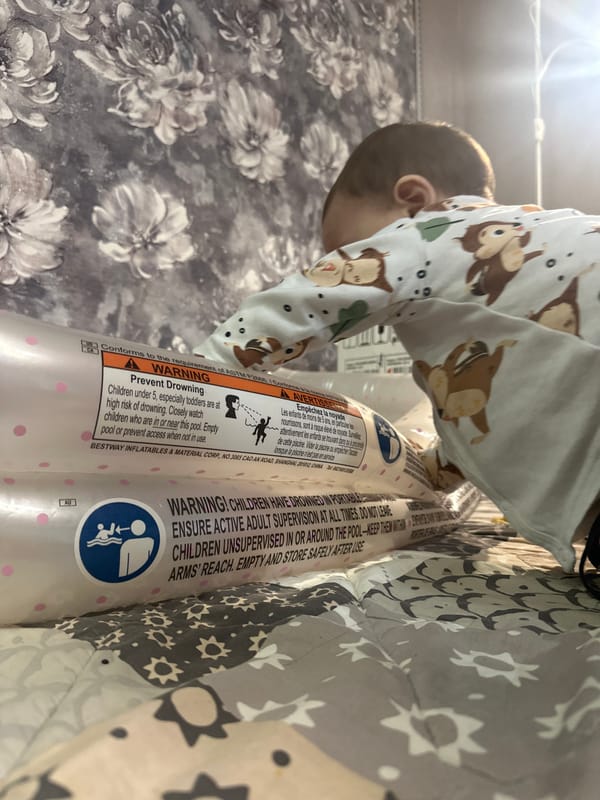 Child and adult documented in domestic setting with pool safety items