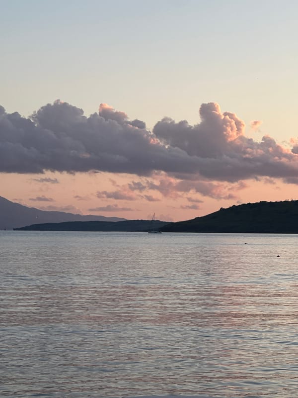 Boat spotted on water during sunset in Bodrum, Turkey