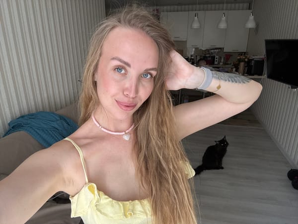 Woman takes selfies with Pomeranian dog in Sirius apartment
