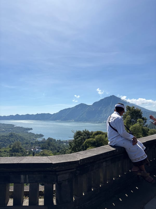 Tourists document scenic Lake Batur views in Kintamani, Indonesia