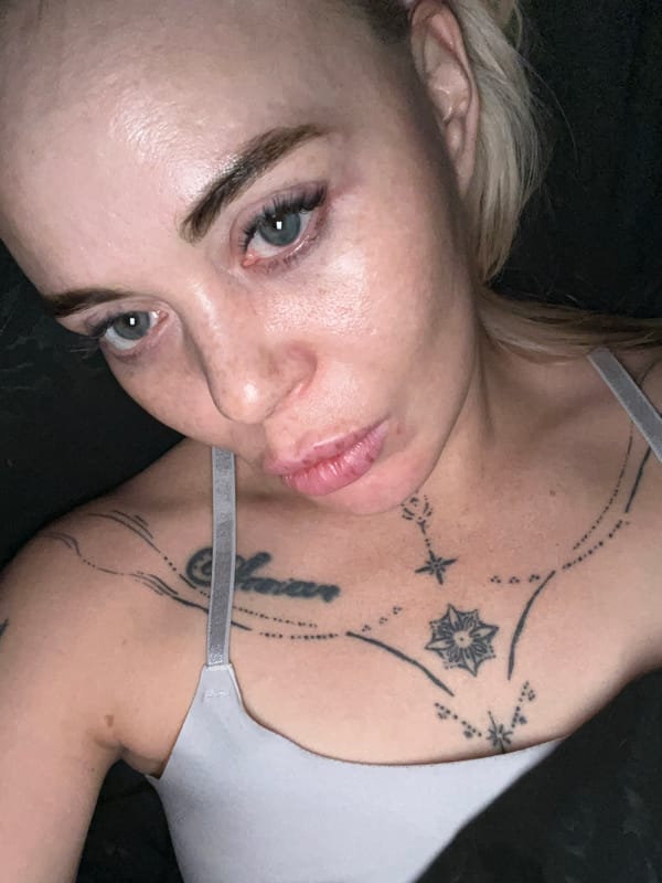Indoor selfie series with pink headband and visible tattoos