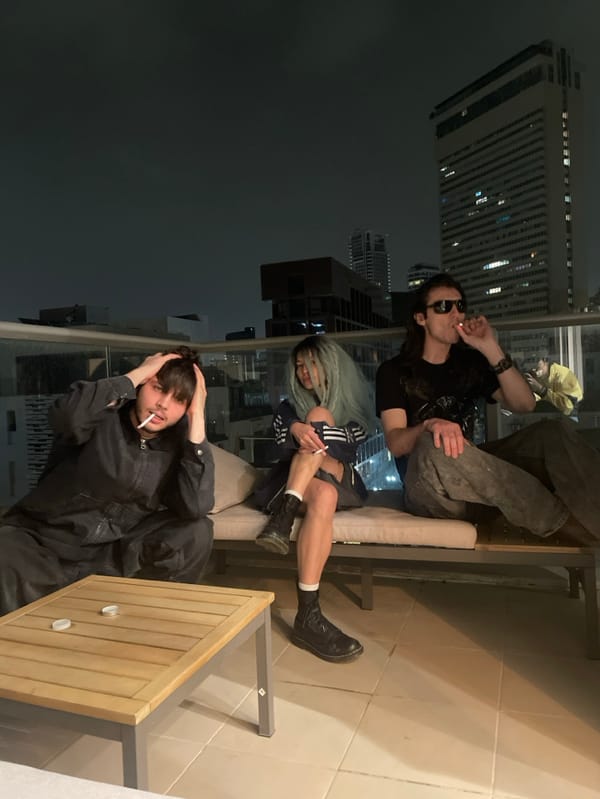 Young adults socialize on Tel-Aviv rooftop terrace Friday night