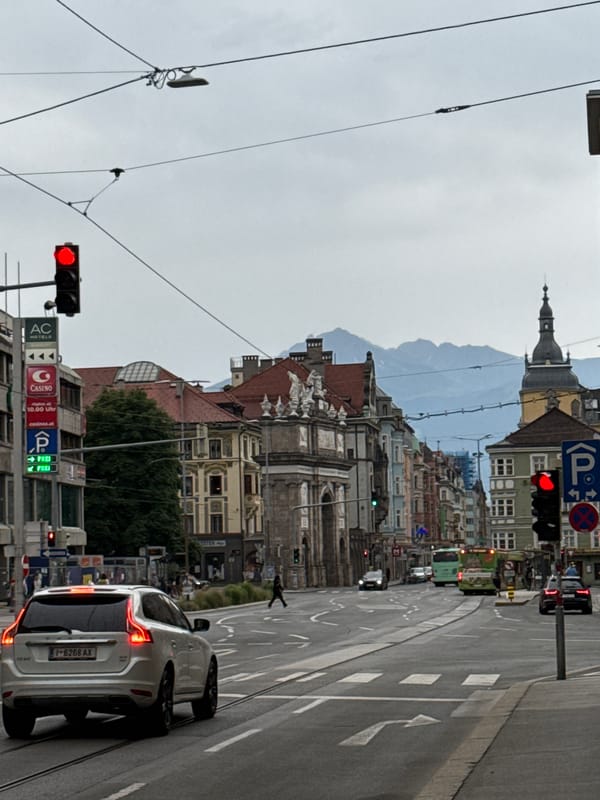 Strolling Innsbruck's city center streets with Alpine backdrop