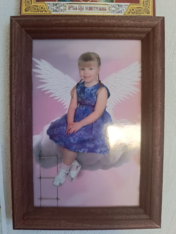 Witness observes framed photograph of girl with angel imagery