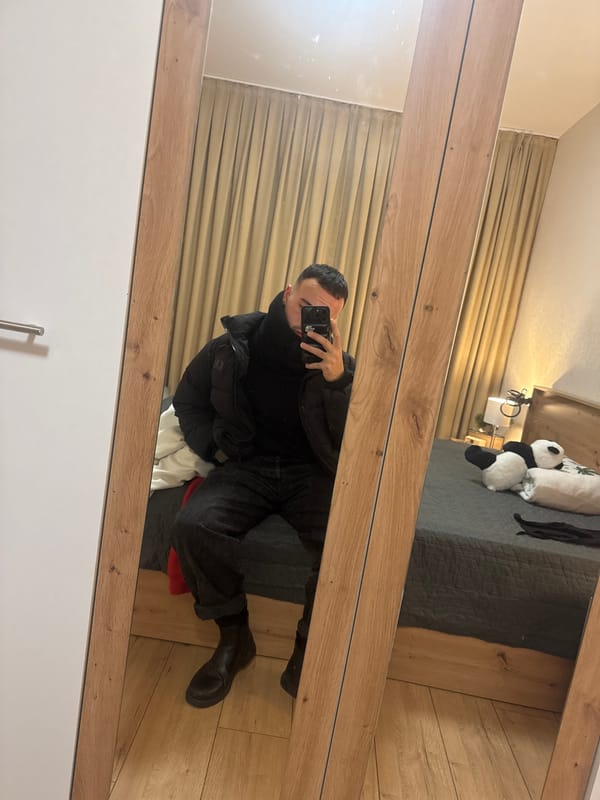 Person takes mirror selfie in Sofia bedroom