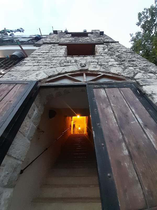 Tourist explores historic Montenegrin villages, documents stone buildings and boats