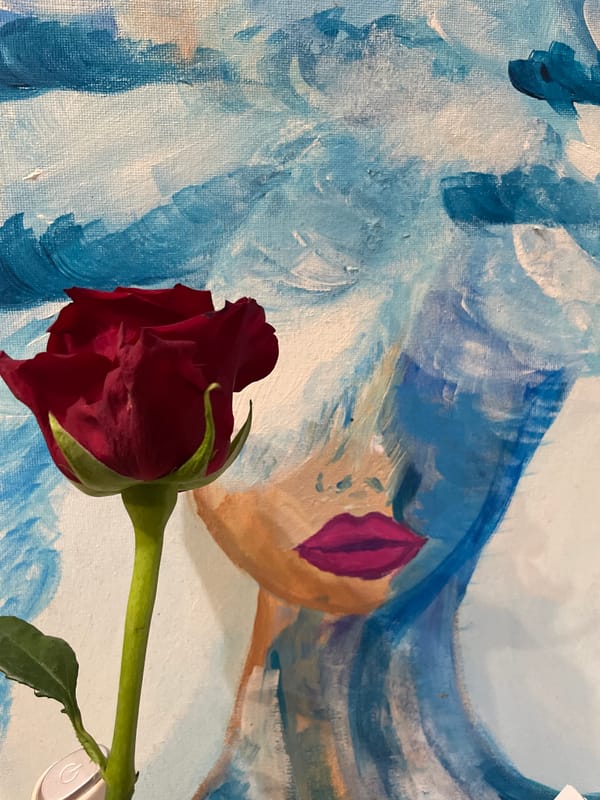Artist arranges red roses with portrait paintings in Sochi