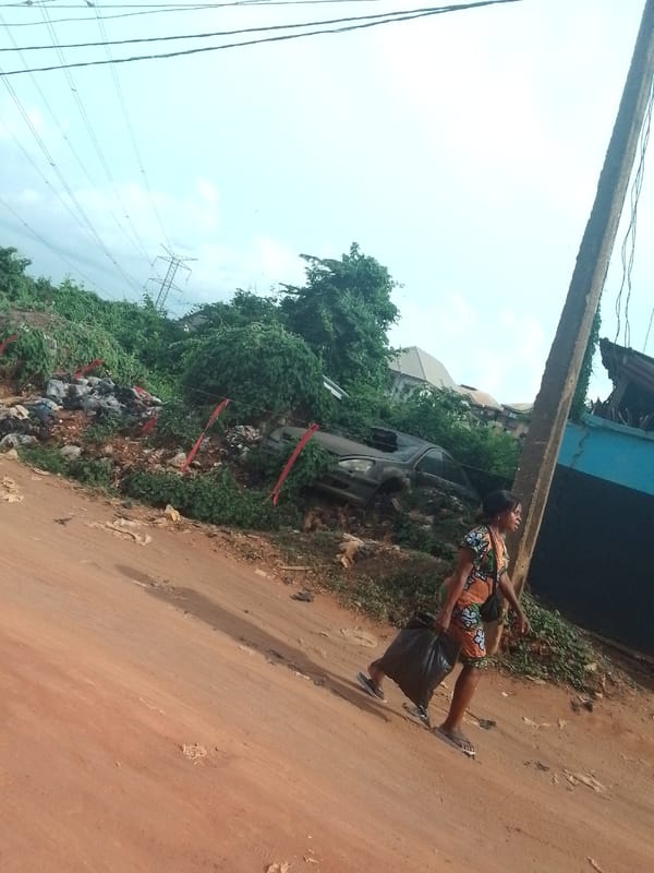 Daily life documented on unpaved streets in Onitsha, Nigeria