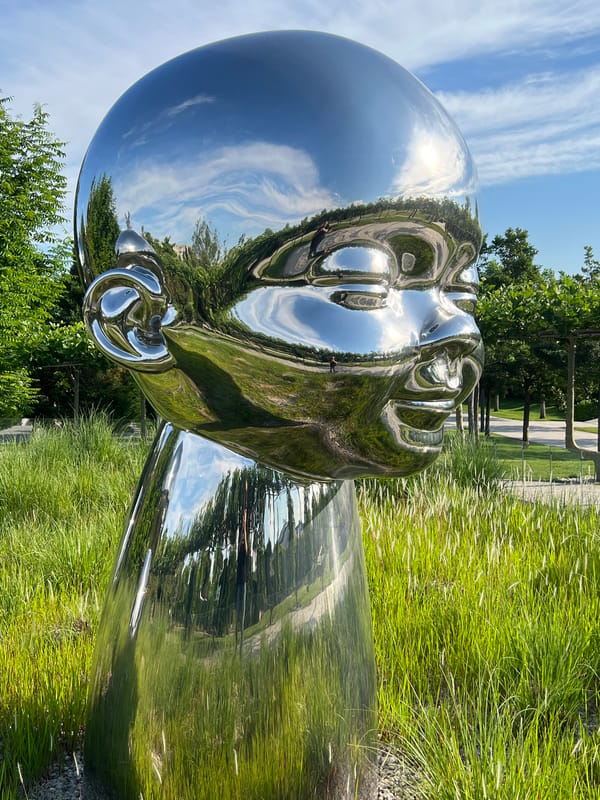 Chrome baby head sculptures draw visitors in Krasnodar park