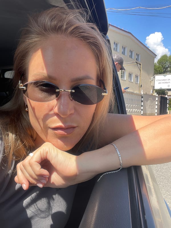 Woman observed in car on sunny day in Sochi