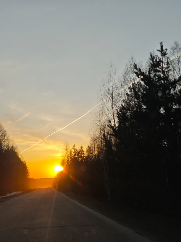 Golden sunset photographed over rural road in Markovo, Russia
