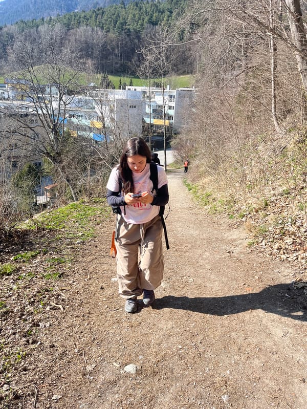 Woman enjoys sunny hillside view overlooking Innsbruck