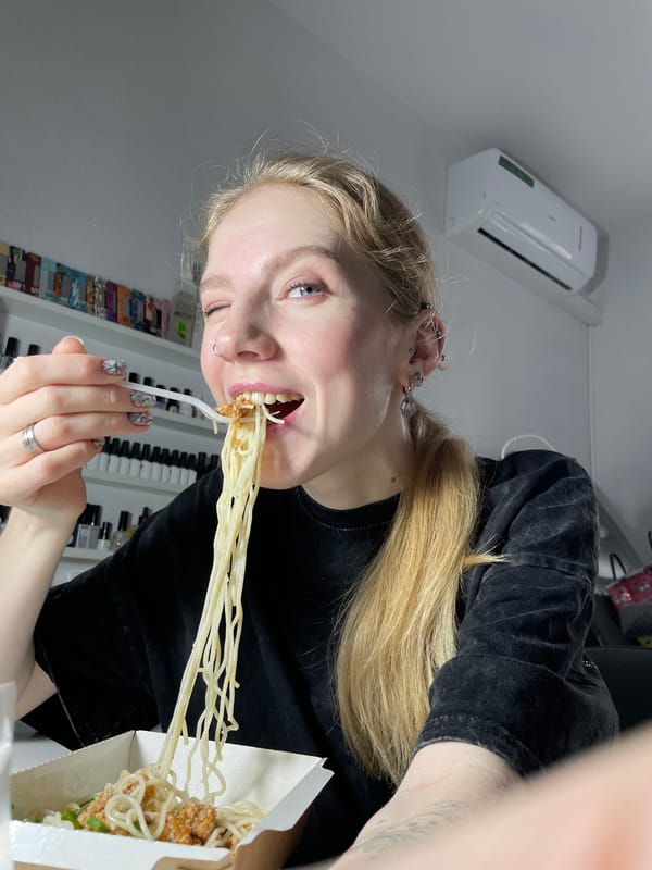 Woman eating noodles observed in Izhevsk, Russia