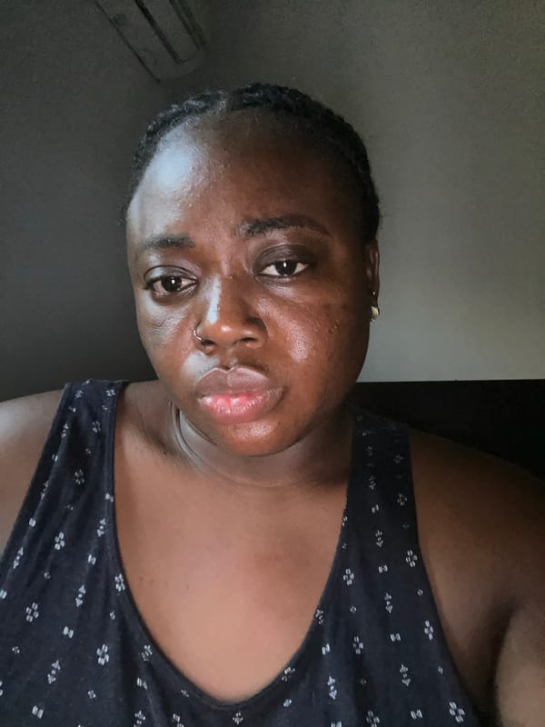 Woman takes selfies in Abuja apartment