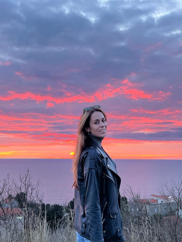 Woman photographs sunset selfies in Montenegro coastal area