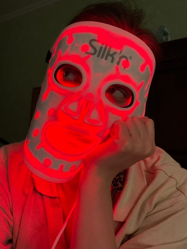 Budapest resident uses LED therapy mask in stone-walled interior