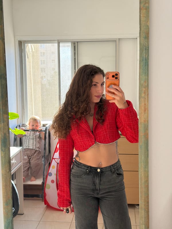 Woman takes mirror selfies in Kiryat Bialik apartment
