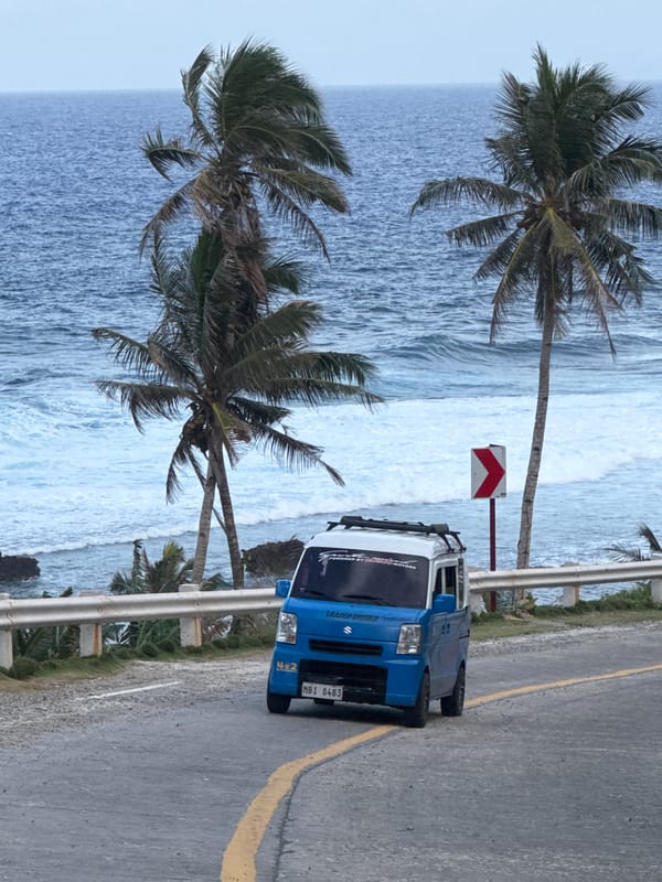 Groups gather along scenic coastal road in Burgos, Philippines