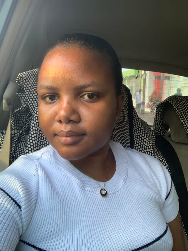 Person in white shirt observed in car passenger seat