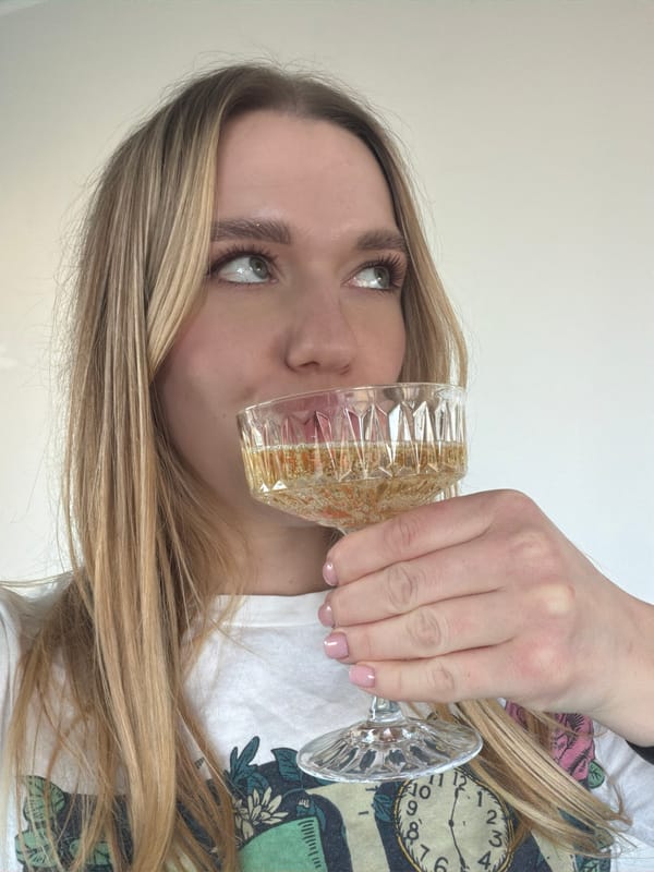 Woman with glass of pale liquid observed in Dreiliņi