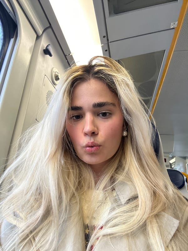 Woman takes selfie while traveling by train in Milan