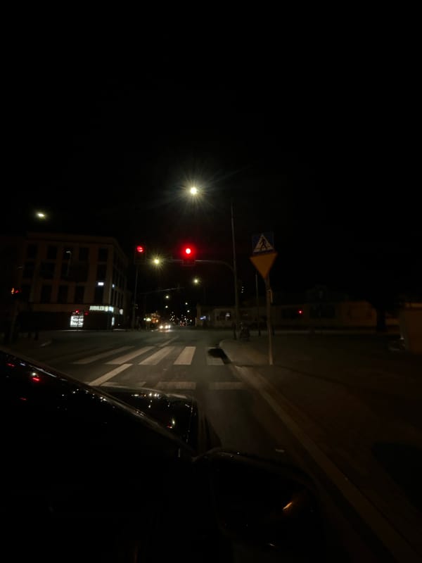 Nighttime drive through Siedlce streets, wet roads and traffic lights