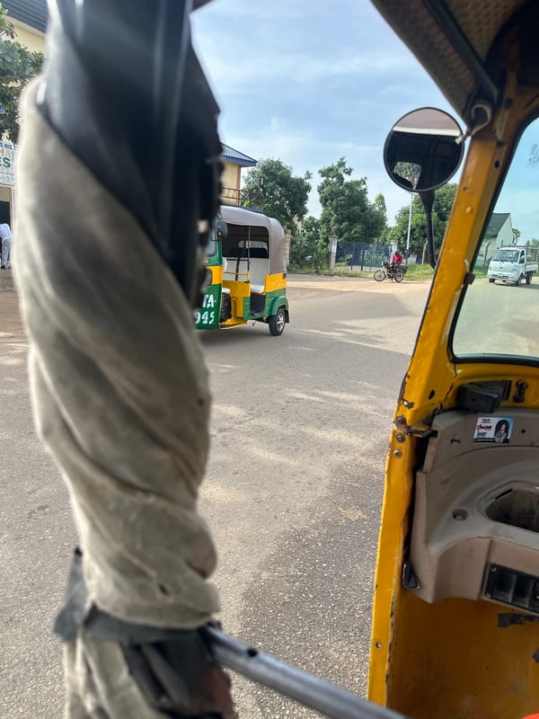 Inside a yellow auto-rickshaw rolling through Bukuru streets