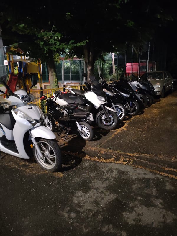 Scooters and motorcycles parked at night in Nesebar