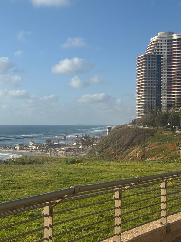 Paraglider spotted over Netanya coastline from multiple viewpoints