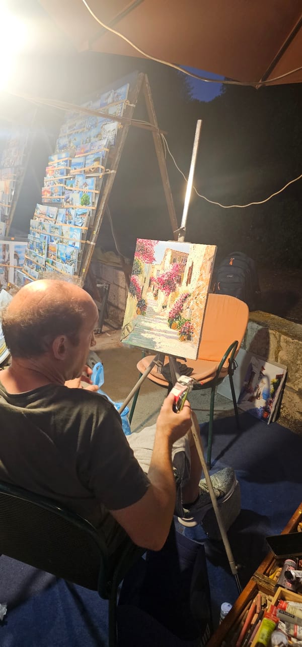 Nighttime plein air painting under lamplight in Supetar, Croatia.