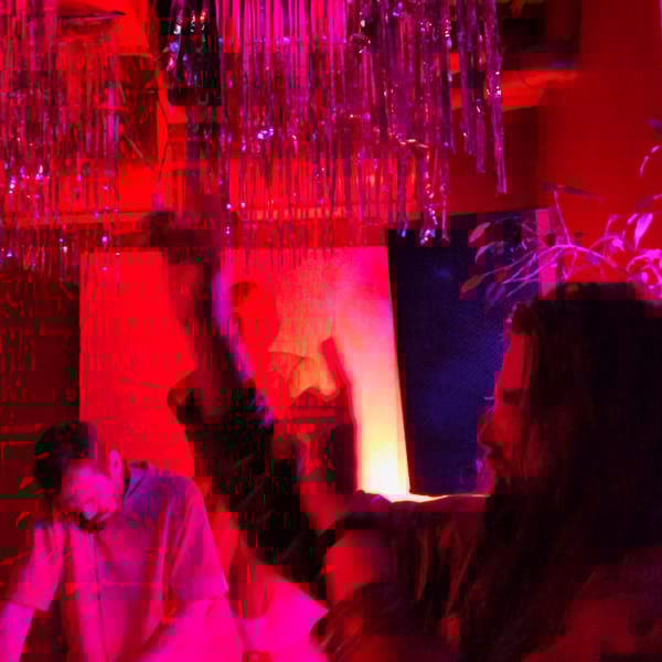 Nighttime party documented in Hrodna with DJ, dancing, socializing