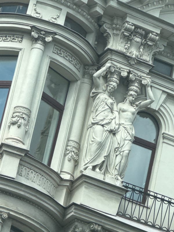 Tourist documents classical architecture tour through Saint Petersburg streets